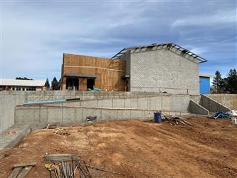 a large concrete ramp without railings headup up to Building A