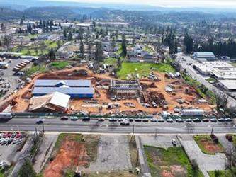 An Aerial view facing South looking at Paradise Elementary under construction.  4 buildings are present in various states