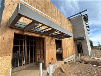 a steel overhang over doors and windows at the office area of Building A