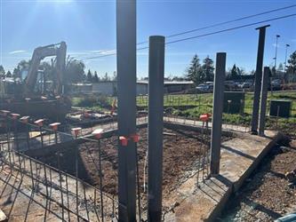concrete footings with pillars sticking up