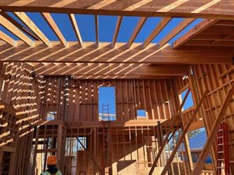 a view of the roof with beams and rafters visable