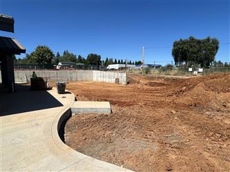 A large dirt area being prepped for the TK-K playground area