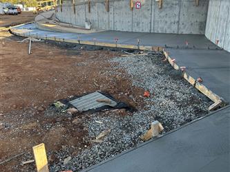 freshly poured concrete sidewalks surrounding the multipurpose room