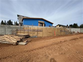 a large curved ramp heading up to Building A where the outdoor stage area is visible