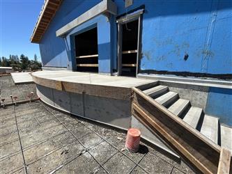 concrete steps and stage at the back of the multipurpose room