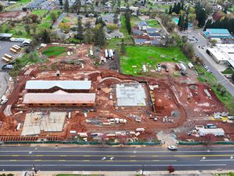 An aerial view facing South of the 4 new buildings at Paradise Elementary.  Two buildings are framed and the others have slabs poured.